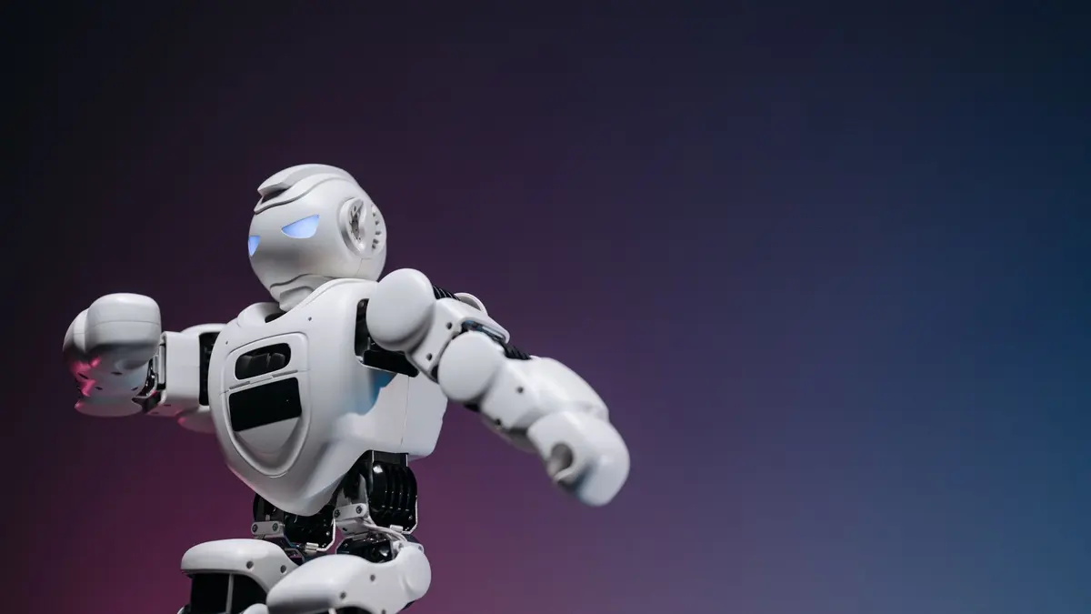 Close-up of a futuristic robotic toy against a gradient background, symbolizing innovation and technology.