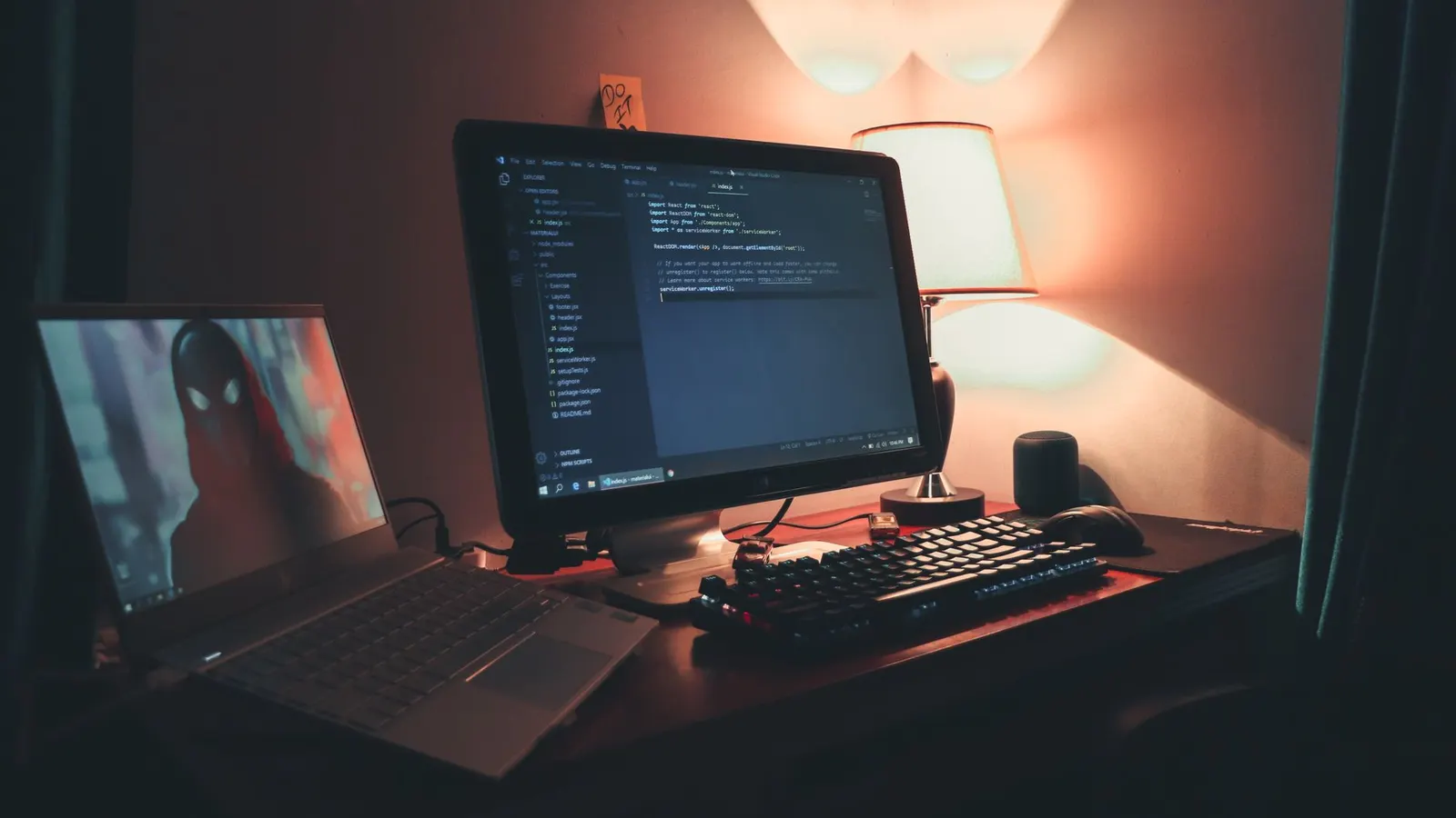 Warmly lit home office with dual screens for coding and programming. Perfect modern workspace for tech enthusiasts.